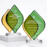 Modern crystal awards with overlapping green and amber leaf shapes