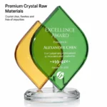 Clear crystal raw material detail on green and amber leaf trophy