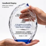 Handheld blue-accent flame crystal trophy showing scale