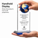 Handheld globe-topped crystal award showing proportions