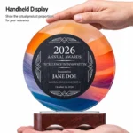 Handheld round crystal and marble award showing scale