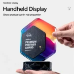 Handheld hexagonal crystal and marble trophy showing scale