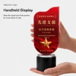 Handheld red flag crystal award display indicating 34 cm product height